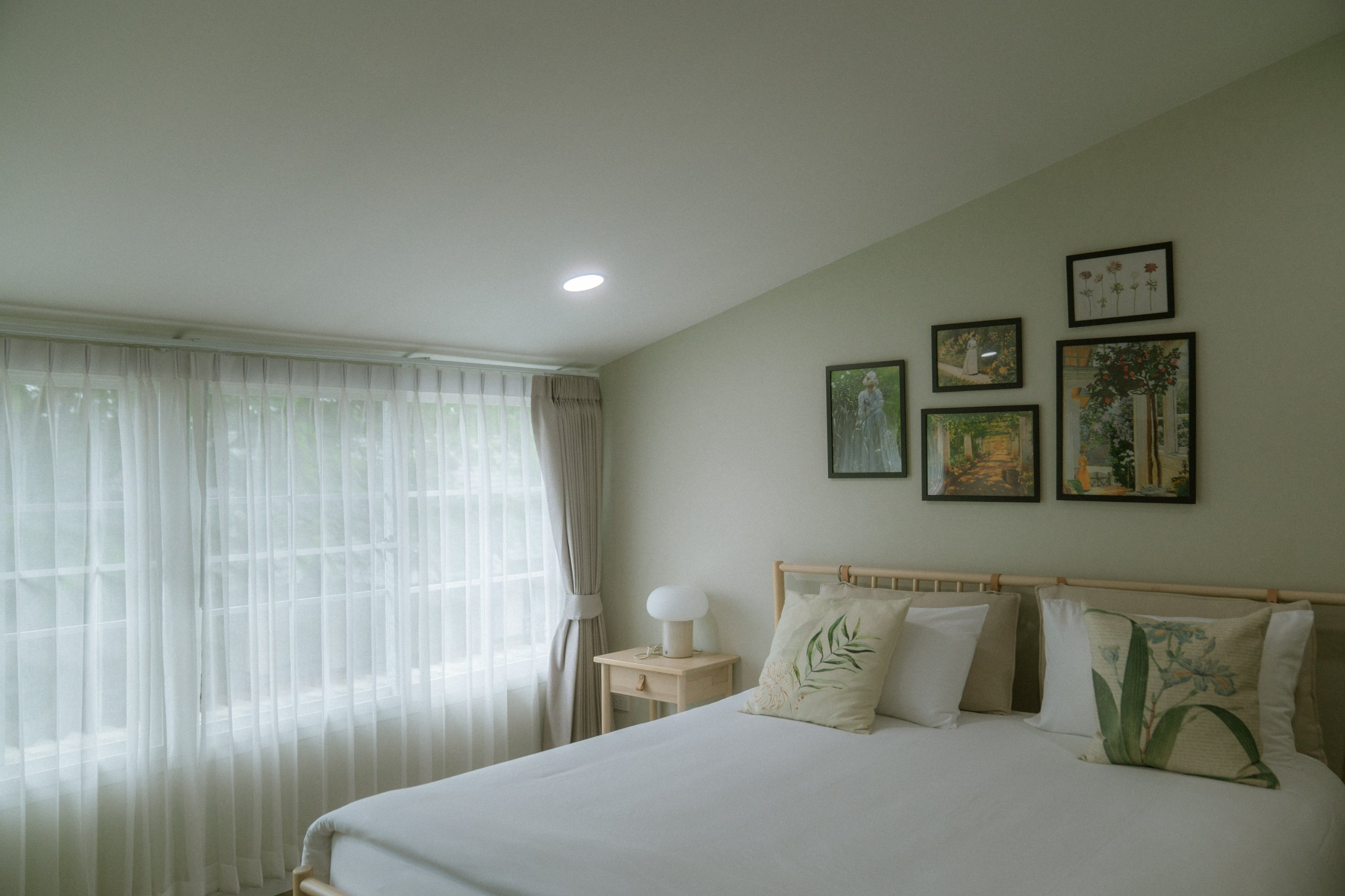 Bedroom with framed prints